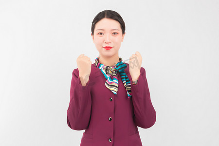 空姐白天美女室内加油握拳摄影图配图空姐早上美女室内礼仪手势摄影图