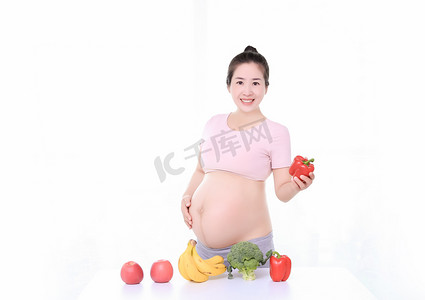 健康饮食蔬菜孕妇运动摄影图配图