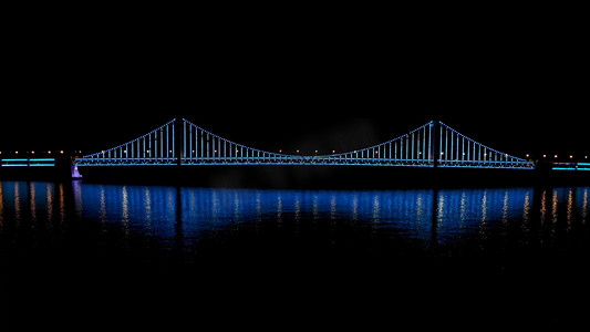 星海湾大桥摄影照片_夜晚高画质航拍星海湾大桥夜景灯光秀