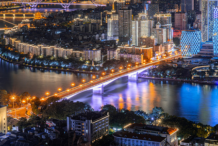 下班高峰期摄影照片_智慧城市夜晚城市交通桥梁桥梁城市户外通勤摄影图配图