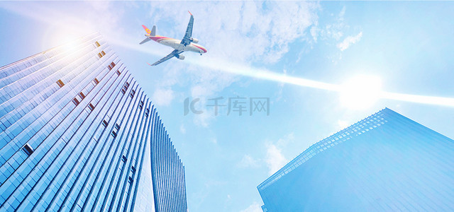 旅游简约风背景图片_飞机城市天空商务城市建筑蓝天