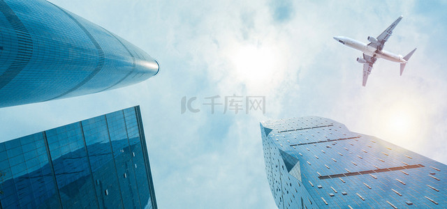 旅游简约大气背景图片_飞机天空城市商务城市建筑 