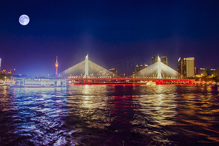 海珠桥夜景摄影照片_广州珠江海印桥上月亮高挂摄影图配图