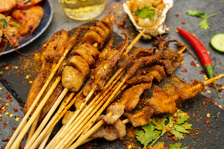 美食摄影照片_烧烤美食白天烧烤串厨房小吃摆拍摄影图配图