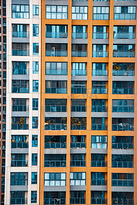 蓝色企业展板摄影照片_城市中午局部城市建筑风光小区在拍摄摄影图配图