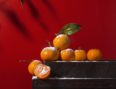 喜庆美食背景摄影照片_静物24节气橘子黄色橘子水果摄影图配图