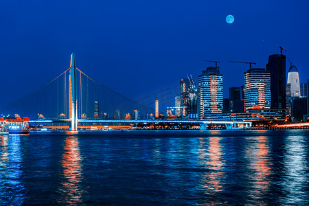 中秋月亮月亮摄影照片_广州市珠江猎德桥建筑月夜摄影图配图