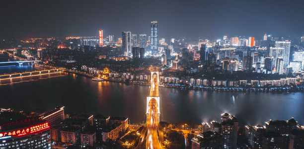 城市夜晚广西柳州红光大桥夜景航拍岸边无人机摄影图配图