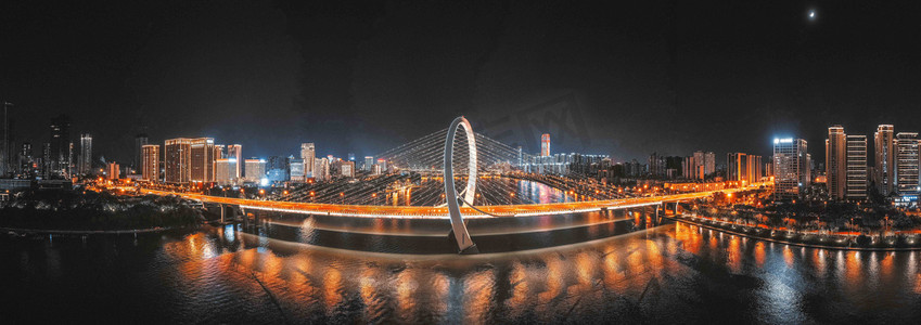 广西故事摄影照片_城市夜晚广西柳州白沙大桥夜景全景江边无人机摄影图配图