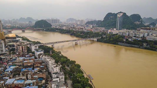 柳州摄影照片_城市中午广西文昌大桥洪水航拍岸边无人机摄影图配图