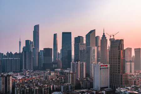 蓝天高楼摄影照片_广州城市建筑夕阳下午建筑天台拍摄摄影图配图