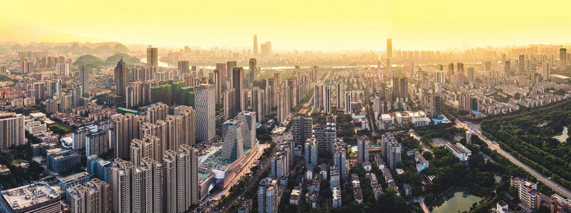 现代建筑摄影照片_城市夕阳广西柳州城市风光航拍楼顶无人机摄影图配图