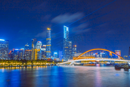 夜上海建筑摄影照片_城市晚上海心桥夜晚蓝金摄影图配图