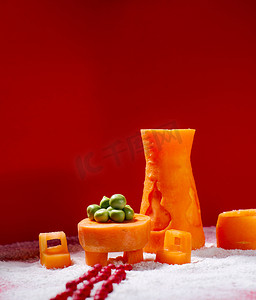 手工雕刻摄影照片_蔬菜棚拍红萝卜蔬果雕刻创意摄影图配图