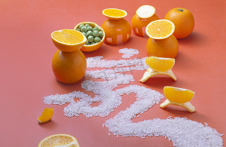 喜庆美食背景摄影照片_蔬果棚拍橙子大米创意摄影图配图