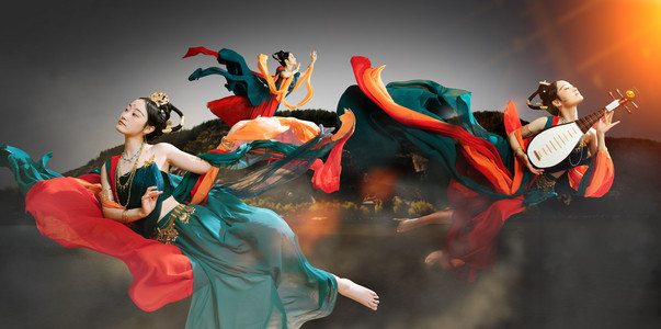 古典中国风水墨画摄影照片_飞天文化复兴夜晚飞天美女洛阳龙门石窟舞蹈动作摄影图配图