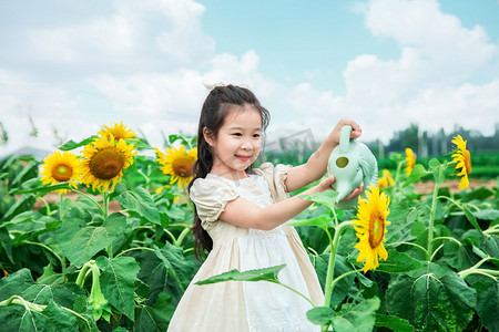 六一儿童节粉摄影照片_人物形象夏天女童户外浇水摄影图配图