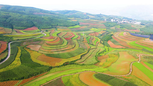 云南旅游房价摄影照片_航拍云南红土地农业耕地梯田