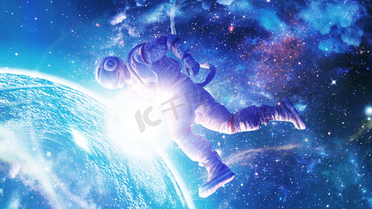 星球未来科技摄影照片_浩瀚宇宙太空人接触蓝色地球白天宇航员宇宙漫步摄影图配图