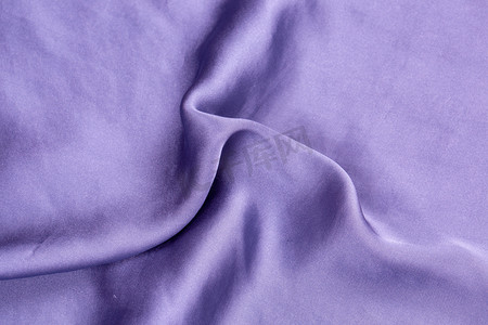 蓝紫色图摄影照片_纺织品纹理褶皱绸缎缎面摄影图配图