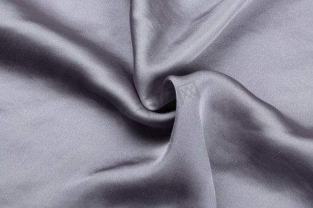 紫色的漂浮物摄影照片_纺织品面料布料服装桑蚕丝紫色摄影图配图