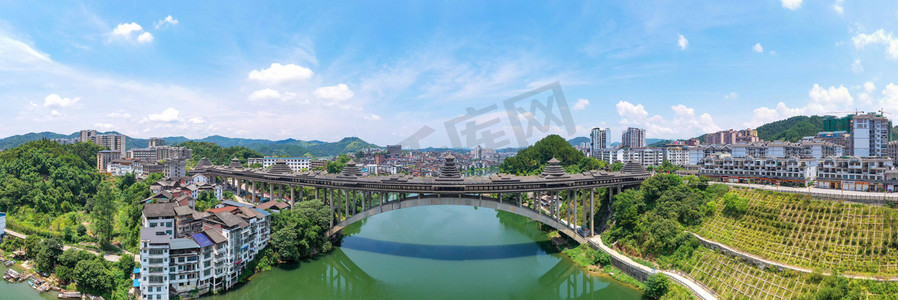 同担风雨共抗疫摄影照片_城市中午广西三江风雨桥全景航拍江畔无人机摄影图配图