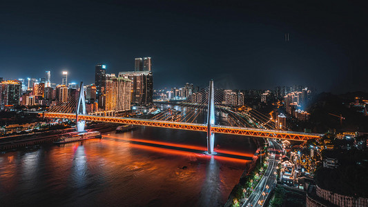 重庆火车穿楼摄影照片_震撼重庆东水门大桥城市CBD车流夜景