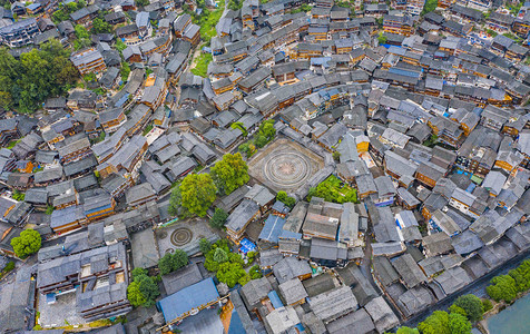 城市古建摄影照片_城市中午贵州西江千户苗寨航拍景区无人机摄影图配图