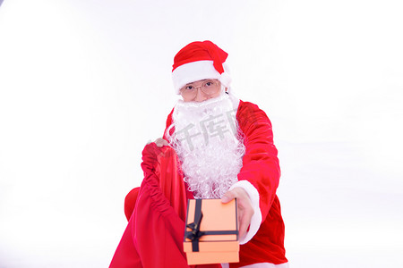 圣诞节礼物圣诞老人人像礼物盒摄影图配图