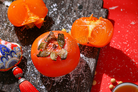 二十四节气秋天摄影照片_霜降秋收红色柿子千禧年创意摄影图配图