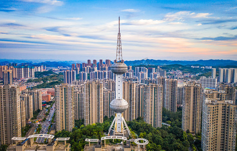 城市建筑楼群摄影照片_城市建筑夕阳贵州贵阳电信塔航拍摄影图配图