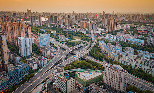 城市立交摄影照片_城市晚霞广西省南宁市青竹立交航拍空中无人机摄影图配图