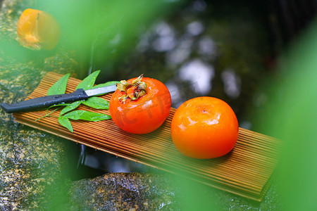 水果秋天柿子红色的创意摄影图配图