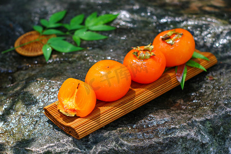 水果摄影照片_水果秋天柿子红色健康食物摄影图配图