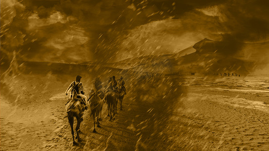 越野摄影照片_沙漠驼队沙尘暴龙卷风白天沙漠骑行驼队沙漠驼队越野摄影图配图