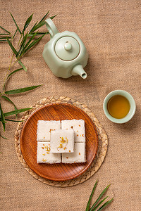 九重阳节摄影照片_美食重阳节中午桂花糕麻布摆放摄影图配图