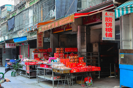 潮汕糖饼白天房子街道摄影图配图