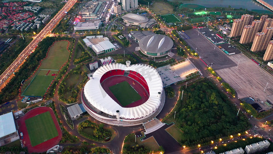 果山体育场足球运动场摄影图配图湖南长沙夜晚日落城市摩天轮摄影图配
