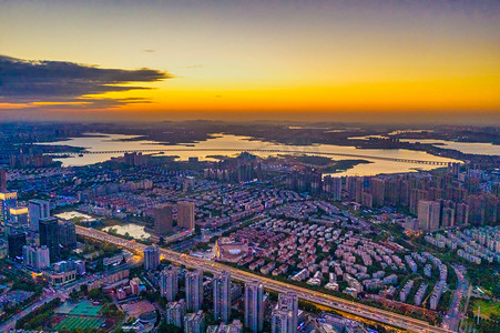 武汉城市建筑日落建筑群经开区日落航拍摄影图配图