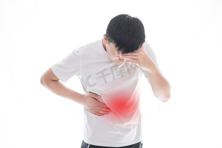 男性下体痛摄影照片_胃疼疼痛生病男性难受摄影图配图