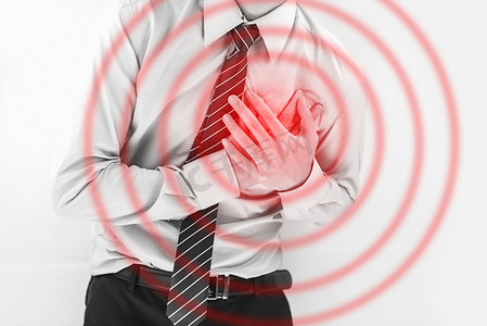 商务男士职业病胸口痛捂着心脏摄影图配图