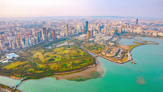 简约大气店铺首页摄影照片_航拍大气俯瞰海南城市CBD天际线