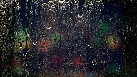 雨滴雨水摄影照片_实拍下雨天玻璃上的雨滴滑落悲伤意境