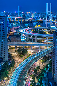 夜景模糊摄影照片_城市交通与城市景观在中国上海的夜景.
