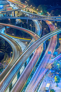 城市模糊夜景摄影照片_夜间上海港立交桥的航景