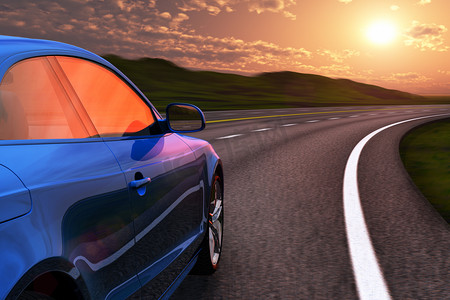 蓝色立体多边形摄影照片_蓝色汽车在高速公路驾驶夕阳