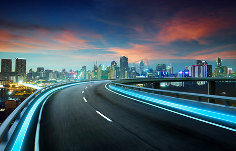 商务摄影照片_霓虹灯光公路在城市景观