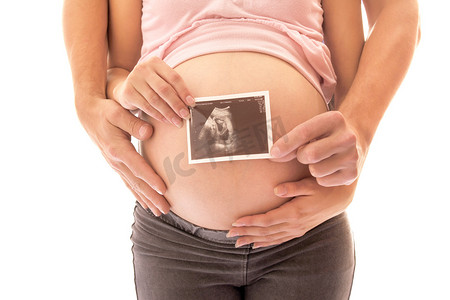 子宫声音摄影照片_怀孕夫妇与超声图像