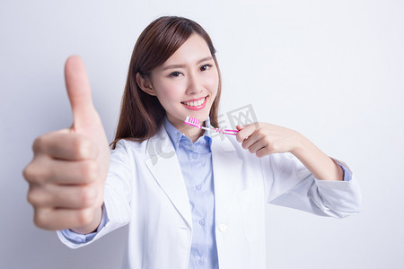 牙科教学摄影照片_人物形象牙医教学如何刷牙