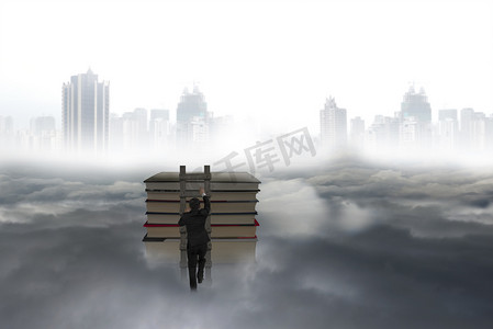 男人节首页摄影照片_Business man climbing on wooden ladder to top of books